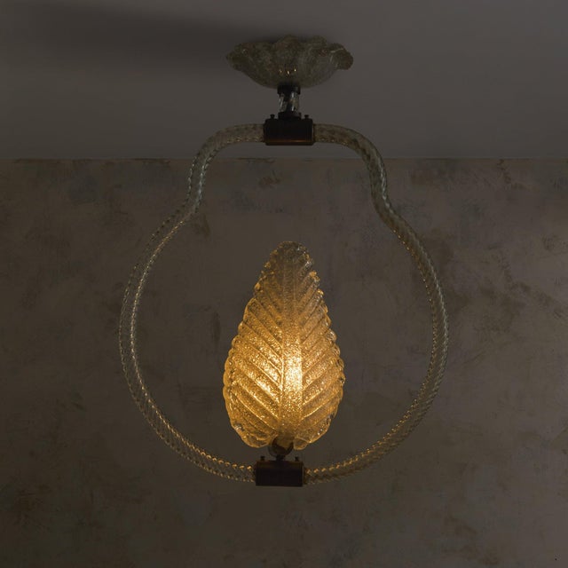 Attributed to Barovier & Toso, this Italian Murano glass leaf basket pendant from the 1940s embodies a dialogue between...