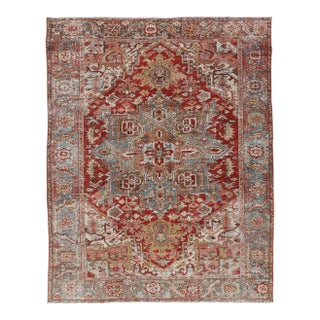 Early 20th Century Antique Persian Heriz Rug With Geometric Medallion Design in Red & Soft Colors For Sale