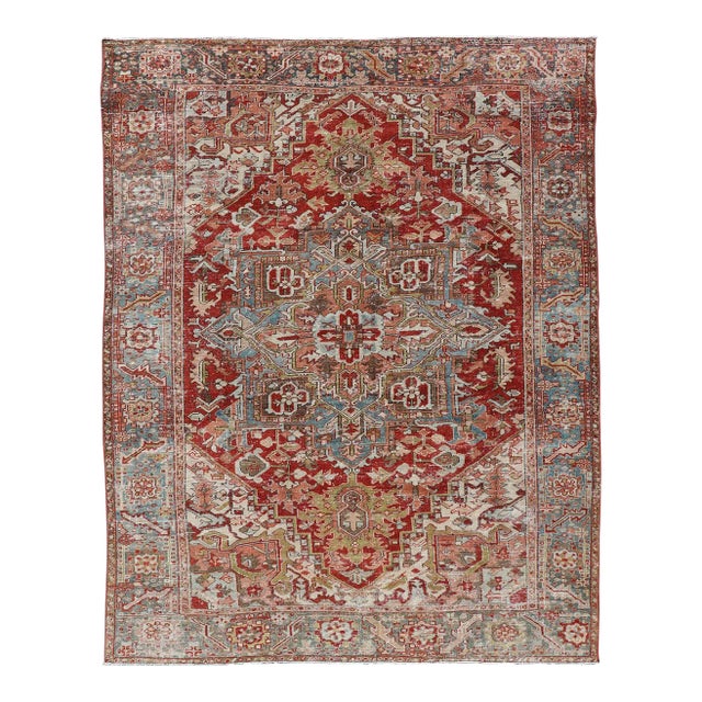Early 20th Century Antique Persian Heriz Rug With Geometric Medallion Design in Red & Soft Colors For Sale
