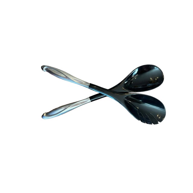 Vintage pair of mid century modern salad set (2 spoons and 1 silver bag for the set) This interesting salad set features...