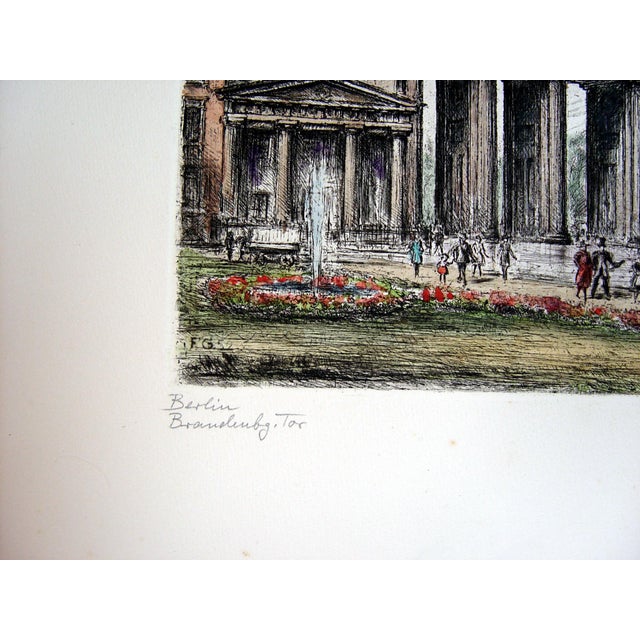 Vintage 1952 hand-colored etching on paper of the Brandenburg Gate in Berlin, Germany. Signed illegibly in pencil lower...