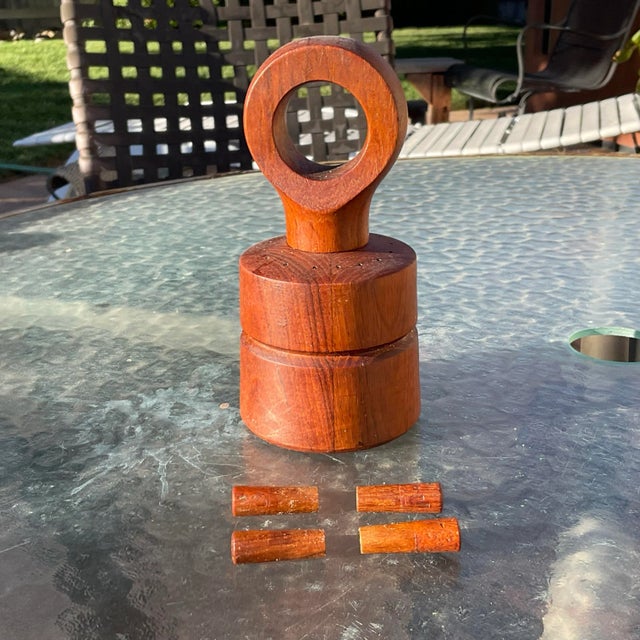 A beautiful vintage wooden eyelet pepper mill and salt shaker designed by Jens Quistgaard for Dansk Designs Ltd. This...