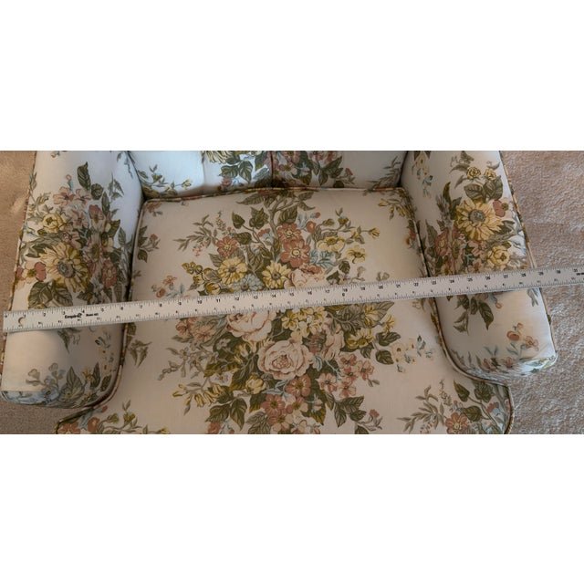 This beautifully preserved floral club chair has been part of a single family home for over 40 years, carefully maintained...