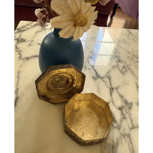 This vintage 1950s Nepalese Tibetan box features an 8-sided, 3-tiered design richly inlaid with coral and turquoise...