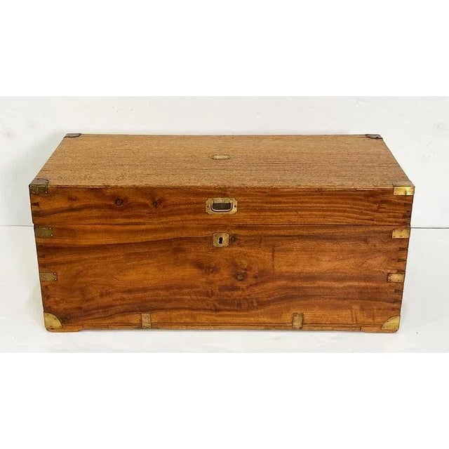 A large handsome rectangular British military officer's Campaign trunk of camphorwood featuring hand-cut brass binding and...