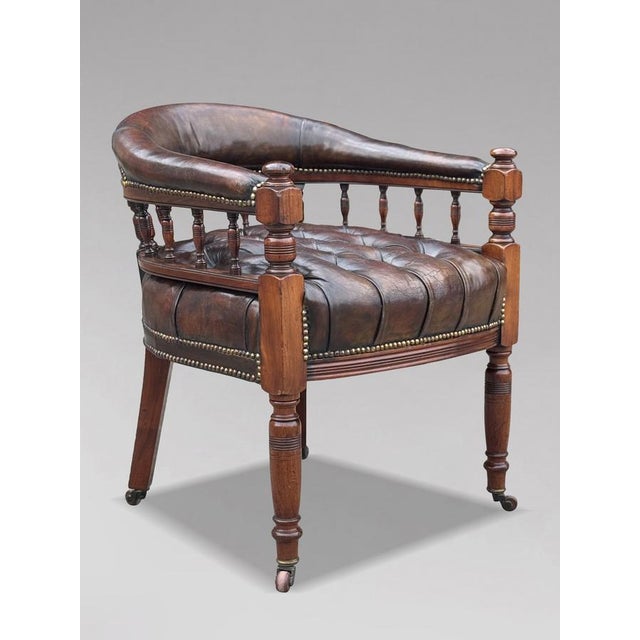 A superb mid 19th-century Victorian brown leather and mahogany captain’s office armchair, dating to circa 1860. This is a...
