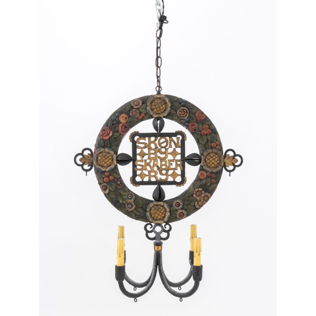 Scandinavian Polychrome Painted Carved Wood and Wrought Iron Four Light Chandelier, with gilt-decorated "Skon by Skaber...