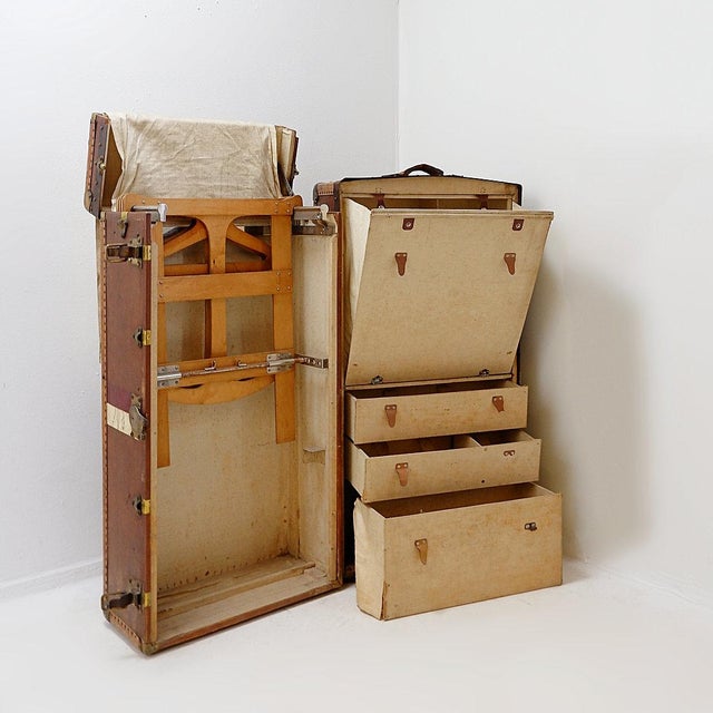 sold as is - The trunk opens vertically into two parts, one equipped with a wardrobe with hangers and the other with...
