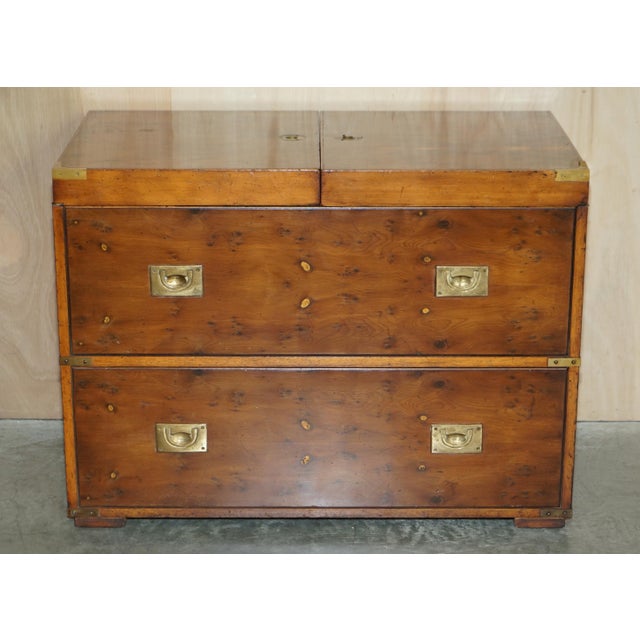 We are delighted to offer for sale this stunning Burr yew wood military campaign chest of drawers which houses a drinks...