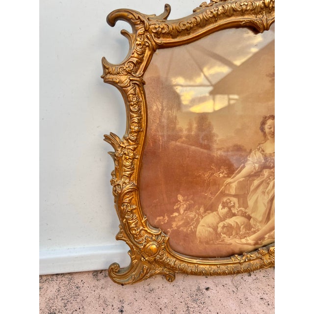 This is a Beautiful Antique French print, with a romantic scene, framed (behind glass) in antique gilded frame. The print...