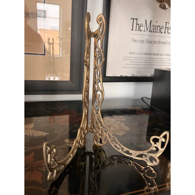 Hollywood regency brass display easel made up of scrolls and botanical designs. Perfect to display your antique plates or...
