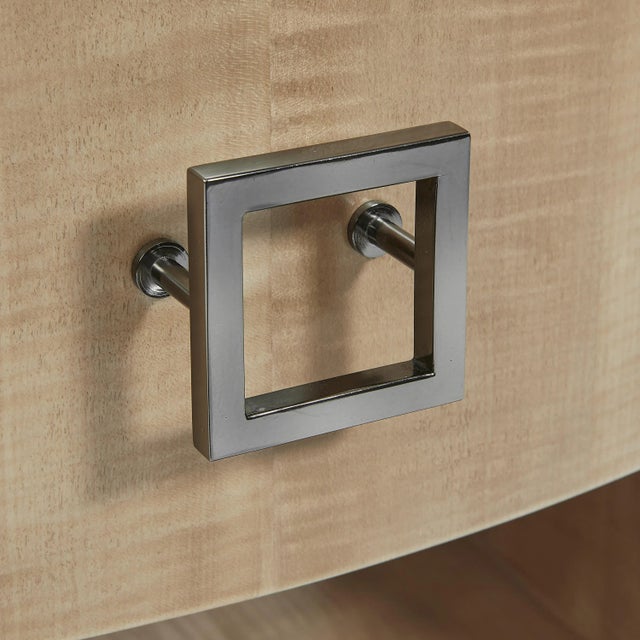 A splendid modern design with an oval top over curved sides that flank a middle storage drawer. Care Instructions: Our...