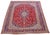This Persian Kashan handmade wool rug has a red field with multicolor accents throughout the design. This rug measures...