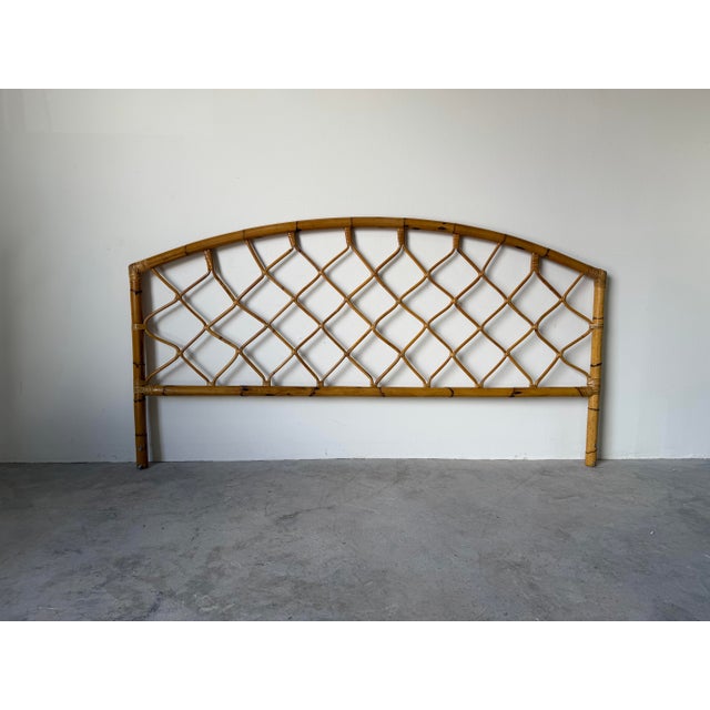 Beautiful vintage bamboo headboard featuring a classic arched silhouette and hand-wrapped rattan lattice design. This...