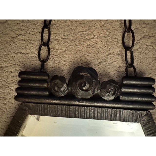 An exceptionally elegant example of French Art Deco decorative ironwork — a hand-forged wrought iron wall mirror in the...