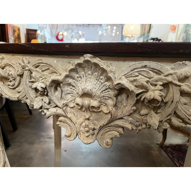 Inspired by early 18th-century Rocaille design, this striking console table boasts an extraordinarily deep, pierced apron...
