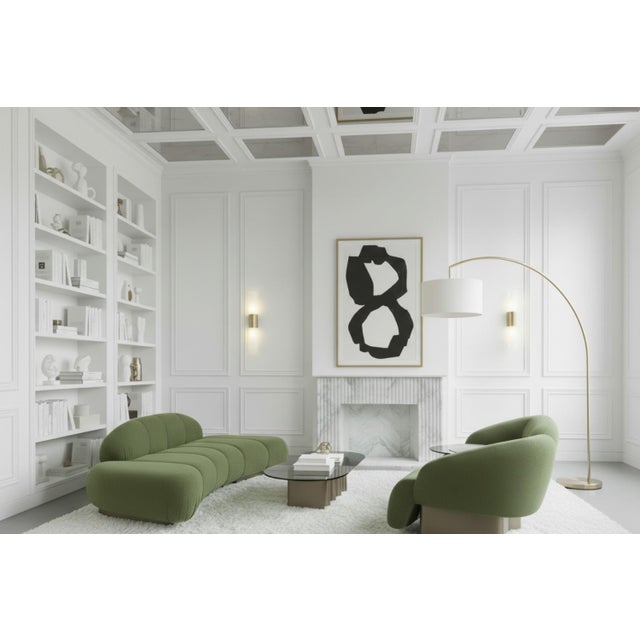 Get cozy with the Green Le Croissant Curved Sofa with boucle fabric. This unique modern piece features a curved channel...