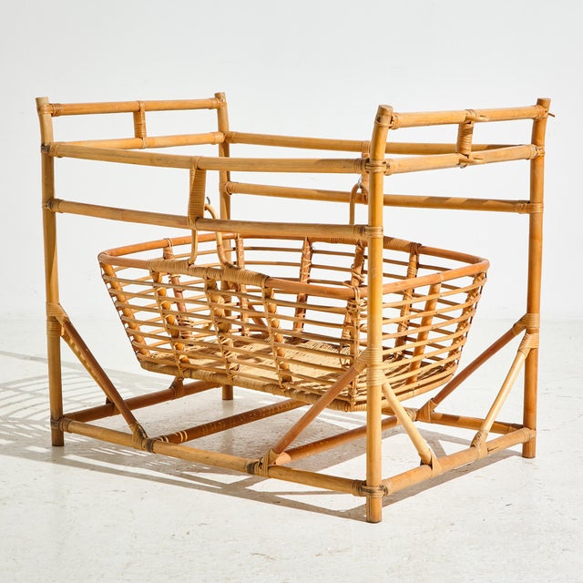 Vintage bamboo cradle from the 1960s with some surface scratches and wear.
