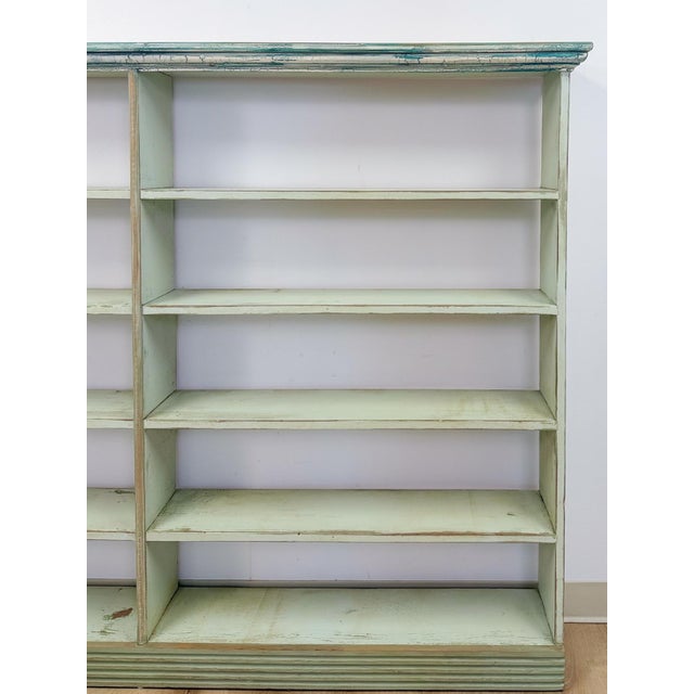 This charming handmade seafoam coastal wood shelf is a beautifully weathered and characterful display piece. The soft...