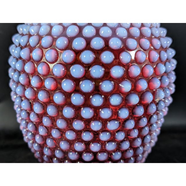 This Midcentury Fenton vase is in wonderful condition. Cranberry red with the hobnail texture and an opalescent finish....
