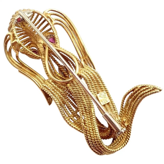 18k Yellow Vintage Diamond and Ruby Basset Hound Dog Brooch Pin by H. Stern. Details: Metal: 18k Yellow Gold Measurements:...