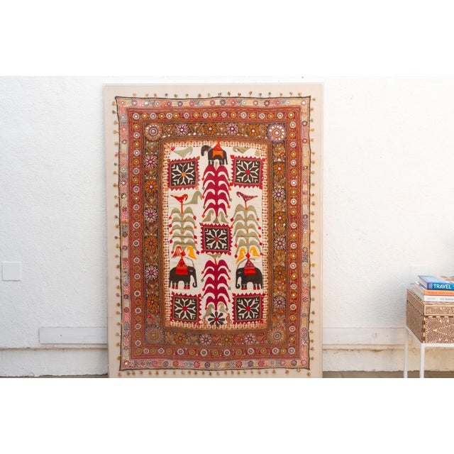 A monumental, festive narrative masterpiece of Indian textile art, alive with hand-loomed texture, ancestral symbolism,...