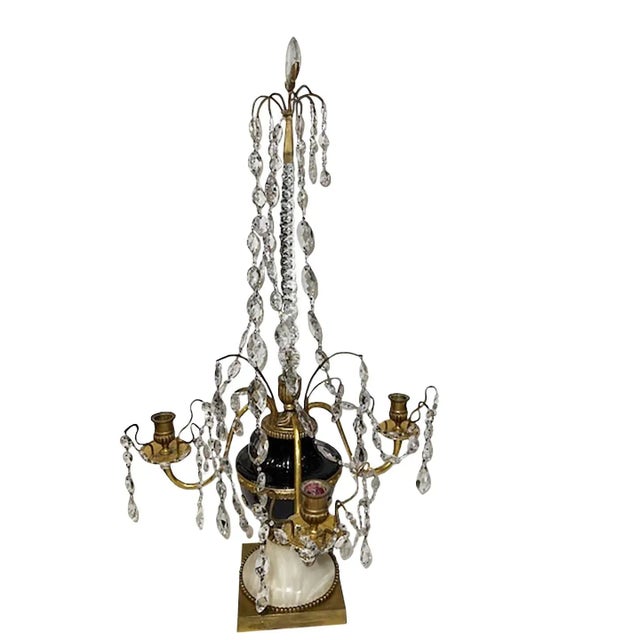A pair of Russian gilt bronze three candle arms with amethyst and clear cut glass prisms, beads and pear shaped drops in...