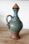 Mid-Century modern art pottery decanter and set of eight goblets. This set is a gorgeous addition to have displayed on a...