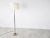 Unique chromed metal floor lamp. It has a nice sculpted brutalist style base and also features two brutalist design...