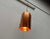 Three mid-century copper pendant lights. The simple pendant lights feature the basic shape of a hexagon. The copper...
