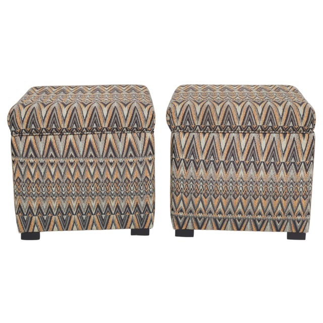 A pair of cube shaped storage ottomans. Upholstered in a vibrant green chevron jacquard, cushioned lids lift up to reveal...