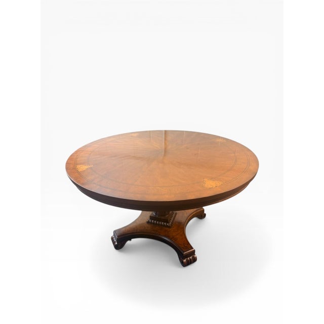 A beautifully executed round dining table attributed to the Ralph Lauren for Henredon era, showcasing classic Regency-...
