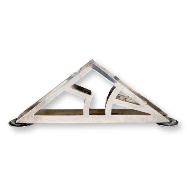 Mid-20th century Israeli modernist napkin holder, marked on the underside Made in Israel. Its bold angular form and...