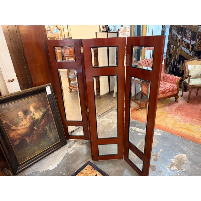 This substantial 4-panel folding screen functions beautifully as an architectural room divider, offering a structured...