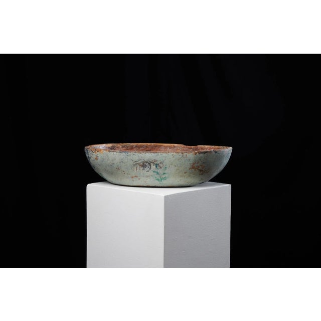 Painted folk art bowl from northern Sweden made during the early 1800s, around 1820. The bowl has an oval shape and has...