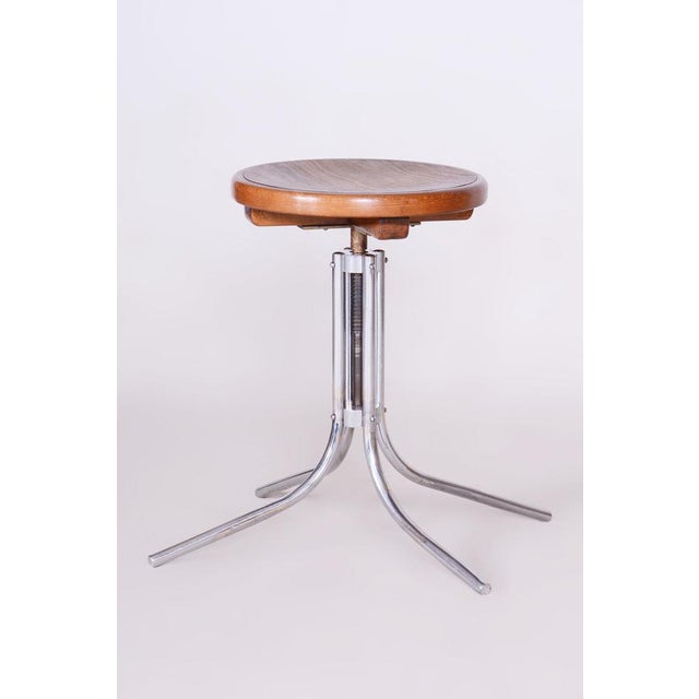 Minimum height: 56 cm (22 in) Maximum height: 67.5 cm (26.6 in) Diameter: 66.5 cm (26.2 in) This piano stool is an...