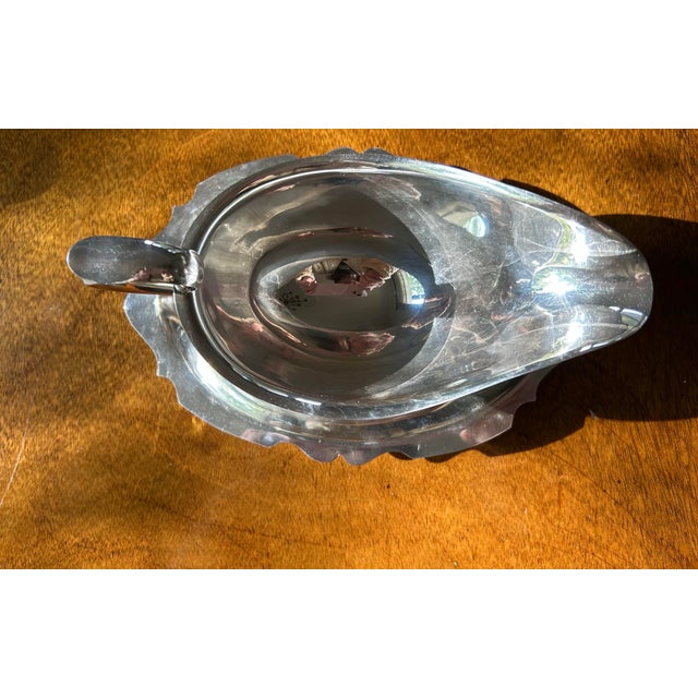 Silver plate gravy boat server with attached scalloped under-plate made by Newport Silver-plate in USA. Bottom stamped...