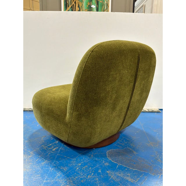 Modern Cloud Swivel Chair with Sage Green fabric. Showroom floor sample.