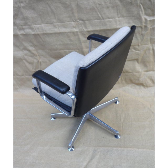 Office chair with upholstered seat and back in natural wool. Dark brown leather armrests and back of the chair. Five-star...