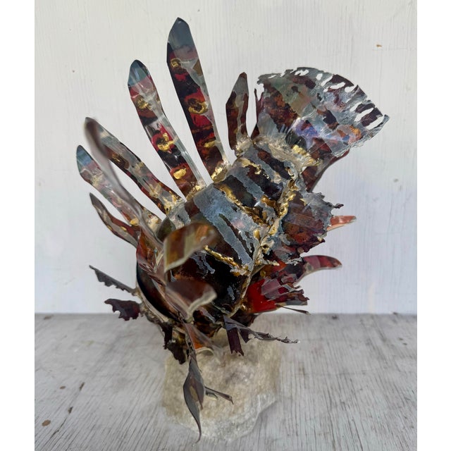 A stunning example of vintage modern decorative art, this unique sculpture features a beautifully crafted tropical lion...