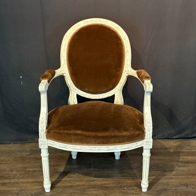 Exceptional pair of 19th century French Louis XVI fauteuil armchairs featuring beautifully executed, intricate carving...
