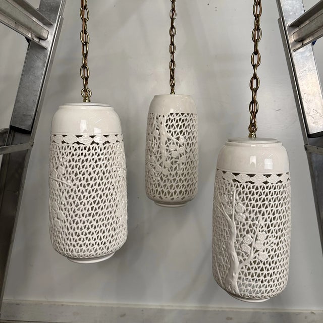 Vintage Beautifully pierced ceramic blanc de chine ceiling fixture with three cylindrical pendants. Porcelain fretwork...