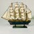 Vintage Home is pleased to offer this wood Tall Four Mast wood Ship Model from the Mid-Century. It features layers of...