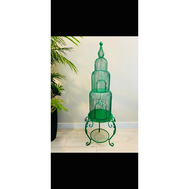 A wonderful birdcage beautiful emerald green. Sturdy wrought iron,this birdcage has so many potential uses, with shelves...