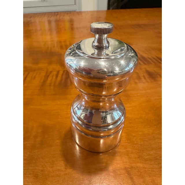Elevate every meal with this exquisite sterling silver pepper mill, a piece that transcends function to become a genuine...