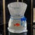 This vintage Murano glass paperweight features a unique fish design inside a hand-blown blue ribbon bag, created by...
