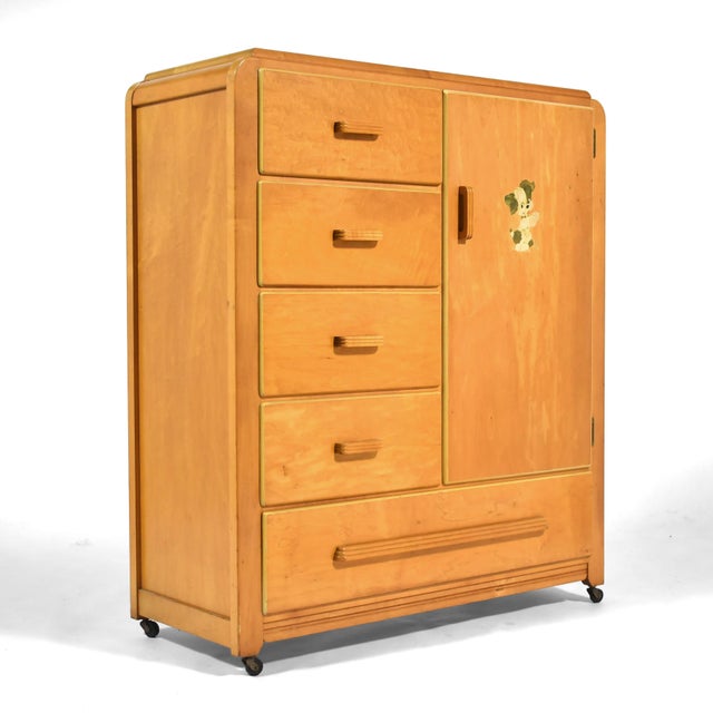 This lovely little child's armoire in maple by Edison Little Folks has handsome deco style detailing and is highly...