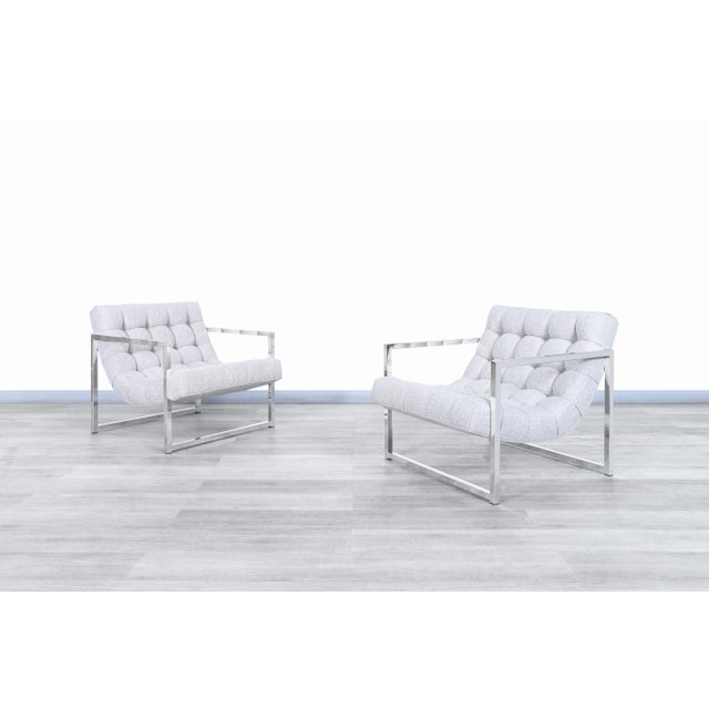 Experience the perfect blend of mid-century modern elegance and comfort with this stunning pair of vintage chrome lounge...