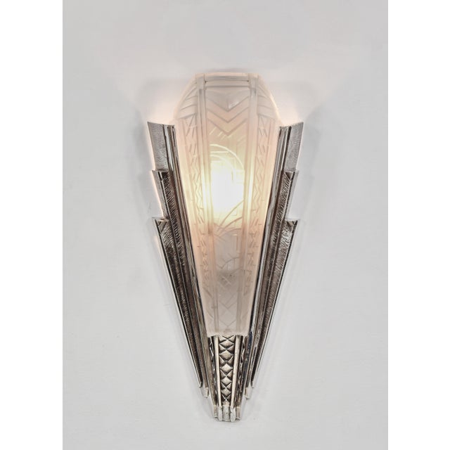 Maynadier A wonderful pair of French art deco wall sconces by Pierre Maynadier made around 1930. The nickel-plated bronze...