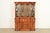 A beautiful Regency or Georgian style lighted breakfront bookcase or dining cabinet with drop front secretary desk In the...